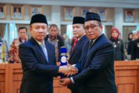 Ganjar Jationo dilantik oleh Sekdaprov Lampung, Marindo Kurniawan, sebagai Kadiskominfotik Lampung. Foto: Kominfotik Lampung.
